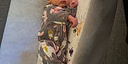Norah is registered to the contest to win money with this photo: newborn, baby, sleeping, crib, onesie, animal_print, pacifier, socks, floral_pattern, blanket, infant, child, soft_toys, bed, cot, quiet, peaceful, cute, indoors, resting