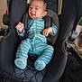 Jayvion joined the competition — help win amazing prizes! baby, baby_clothes, black_car_seat, blue_onesie, car_seat, child, comfort, cute, footwear, happy, indoor, infant, person, portrait, safety, seatbelt, seated, smiling, striped_clothing, young_child