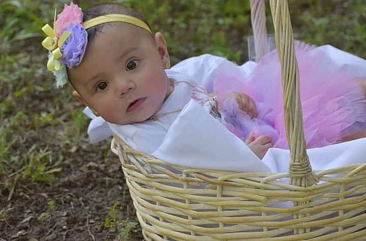 Avery Abriella is registered to the contest to win money with this photo: baby, baby_toddler_clothing, basket, child, event, fashion_accessory, flower, fun, grass, happy, headband, headwear, leisure, people_in_nature, person, picnic_basket, pink, plant, recreation, sitting