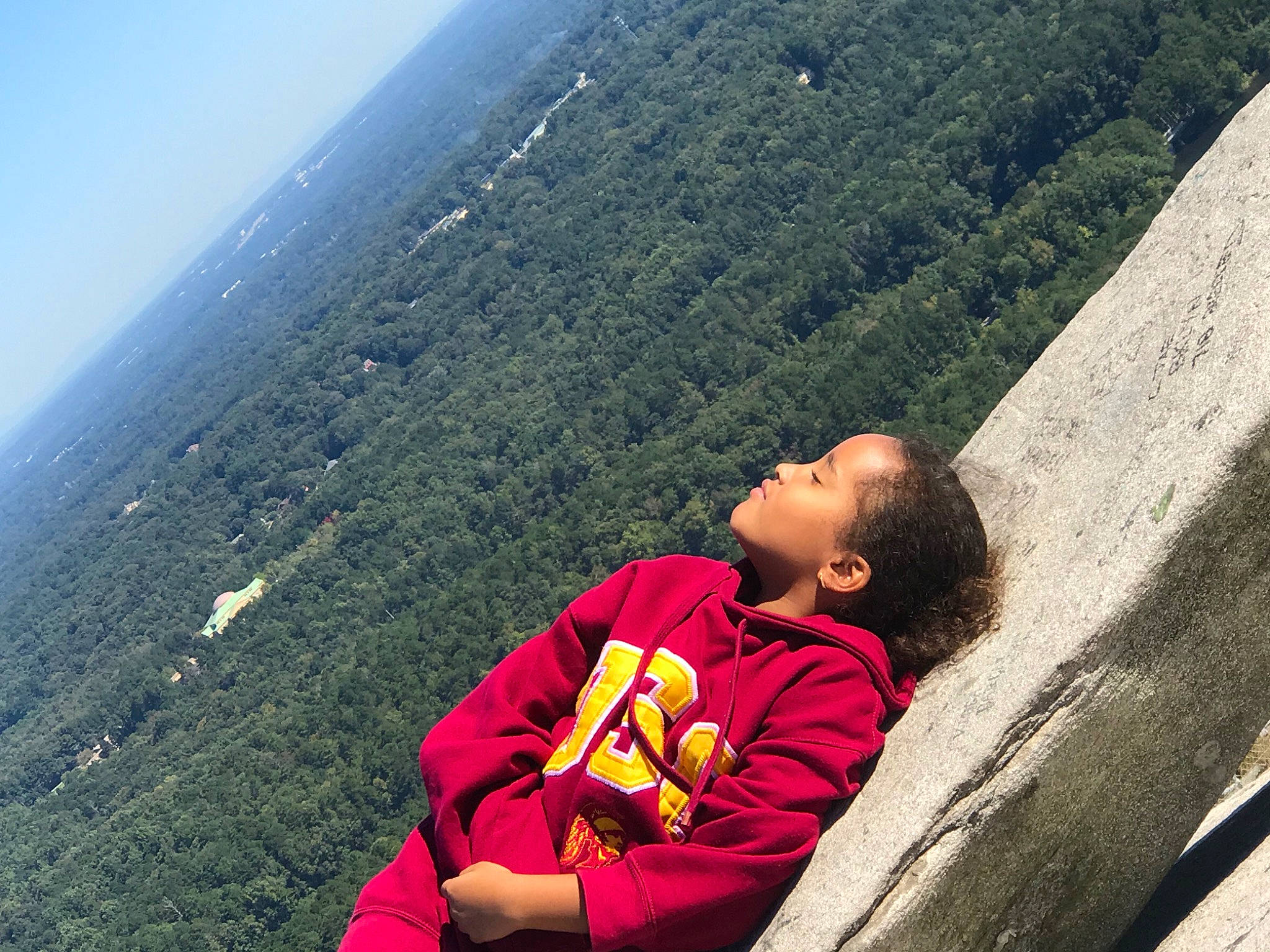 Rebekah joined the competition — help win amazing prizes! adventure, fun, grass, happy, hill, hill_station, landscape, leaf, leisure, mountain, mountain_range, mountainous_landforms, people_in_nature, person, recreation, rock, sitting, slope, toddler, travel