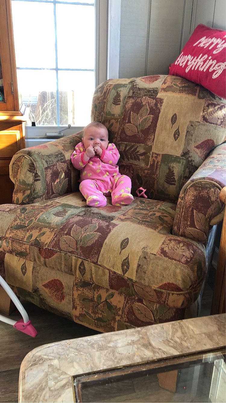 Megan joined the competition — help win amazing prizes! baby, baby_toddler_clothing, comfort, couch, floor, flooring, hardwood, interior_design, linens, living_room, pattern, person, pillow, room, sofa_bed, studio_couch, textile, throw_pillow, toddler, window
