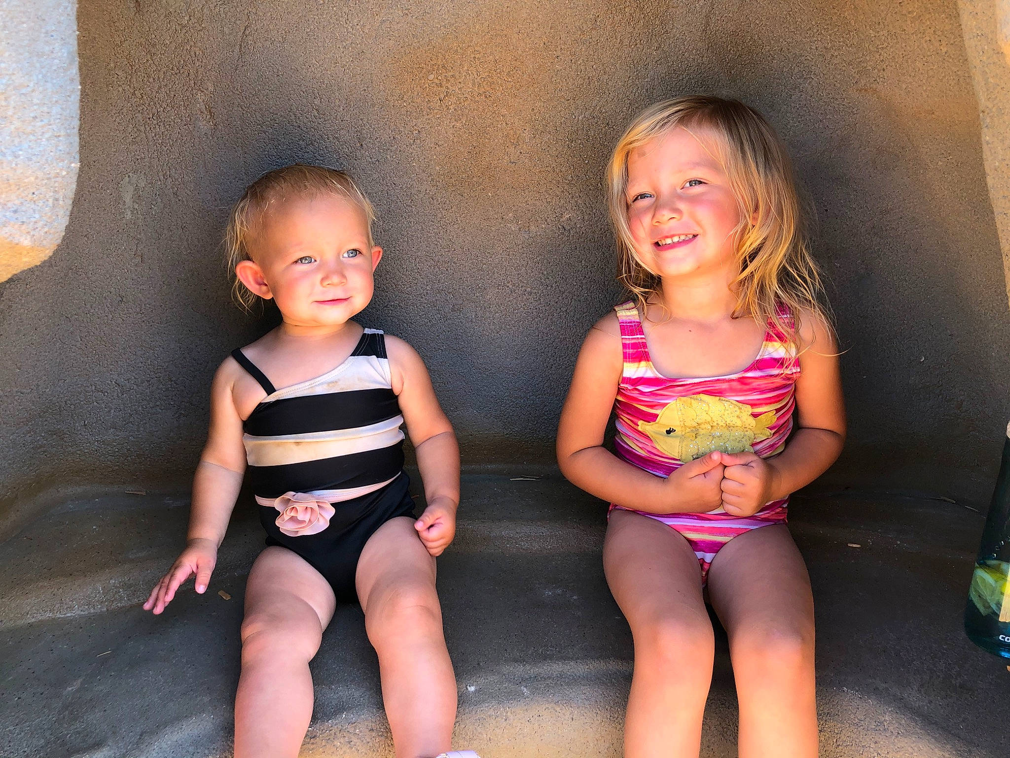 Elise is registered to the contest to win money with this photo: child, fun, joy, leotard, maillot, one_piece_swimsuit, person, sibling, swimwear, toddler