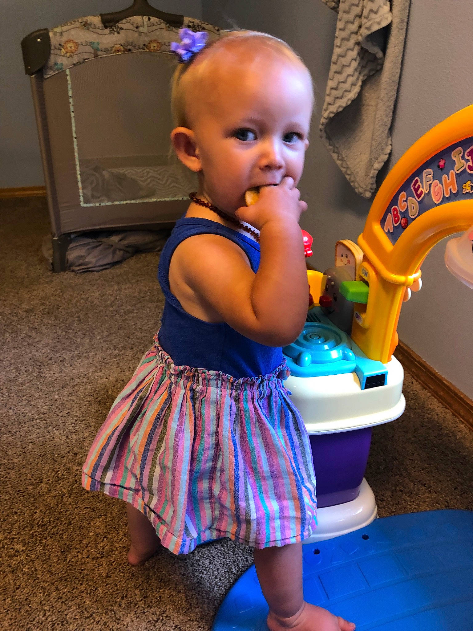 Lillia is registered to the contest to win money with this photo: baby, child, dress, fun, person, play, product, sitting, skin, toddler, vacation, water