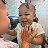 toddler, child, mirror, reflection, smile, hands, hair, twists, bathroom, tiles, sink, paper_towel_dispenser, clothing, short_sleeves, cute, happy, person, indoor, portrait, face