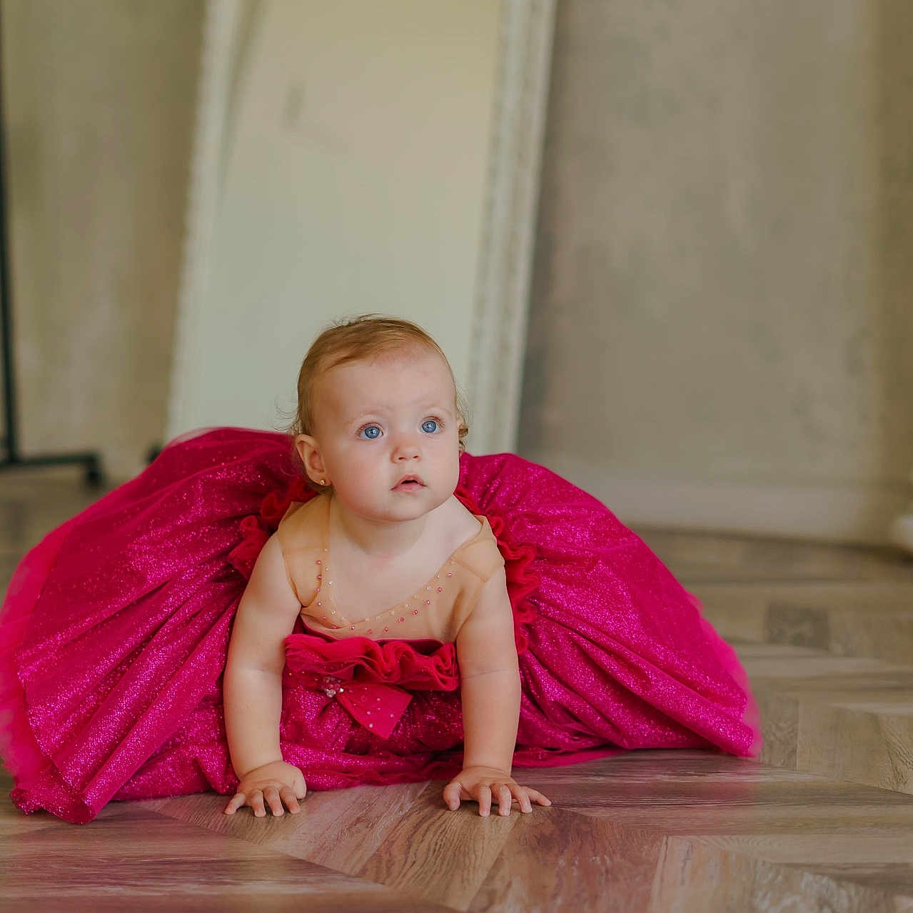 Elyse is registered to the contest to win money with this photo: adorable, baby, blue_eyes, child, crawling, curiosity, curly_hair, cute, dress, floor, flooring, indoor, mirror, person, pink, portrait, skin, sparkle, wooden_floor, young_child