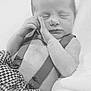 baby, newborn, infant, sleeping, face, hands, suspenders, blanket, houndstooth_pattern, black_and_white, portrait, close_up, skin, bedding, cute, peaceful, newborn_photography, soft_light, hand_pose, small_person