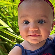 Malia joined the competition — help win amazing prizes! baby, child, headband, outdoor, greenery, plants, smile, face, tank_top, blue_clothing, cute, portrait, young_child, skin, eyes, closeup, sunlight, nature, happy, person