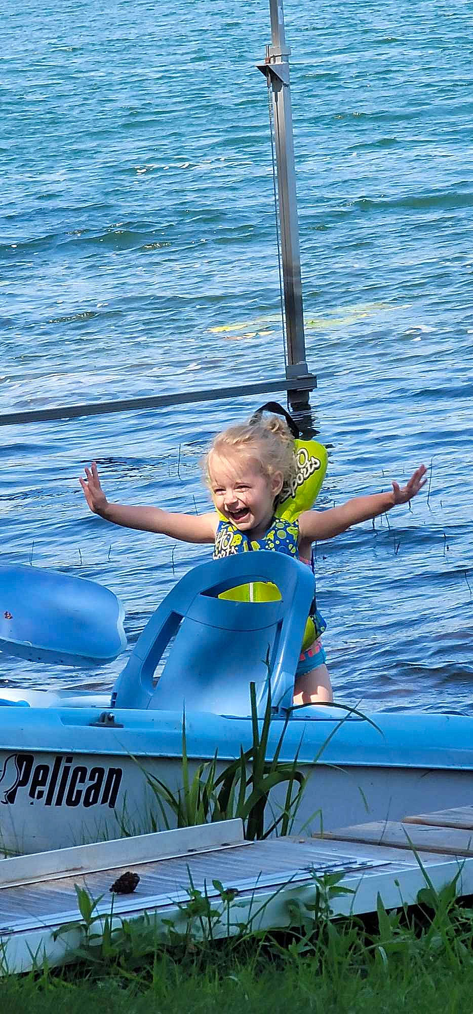 Aliyah is registered to the contest to win money with this photo: boat, boats_and_boating_equipment_and_supplies, child, electric_blue, fun, happy, hood, joy, lake, leisure, lifejacket, ocean, person, personal_protective_equipment, recreation, smile, toddler, vehicle, vehicle_registration_plate, water