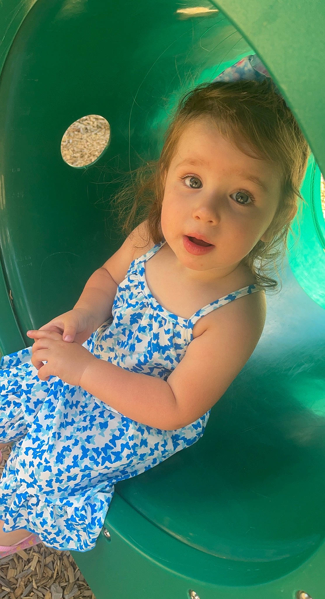 Ida is registered to the contest to win money with this photo: aqua, azure, baby_toddler_clothing, child, electric_blue, face, flash_photography, fun, grass, green, hairstyle, happy, human_body, iris, leisure, long_hair, pattern, person, sitting, skin