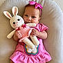Salomé is registered to the contest to win money with this photo: baby, child, colorful, cozy, crocheted_bunny, cushion, cute, hands, happy, headband, indoor, infant, legs, pink_dress, playful, portrait, smile, soft_texture, toy, white_socks