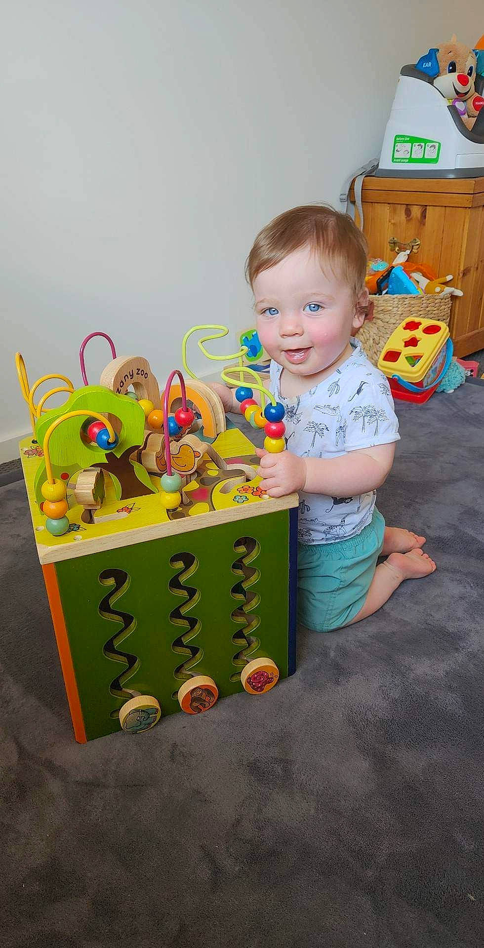 Joseph joined the competition — help win amazing prizes! art, baby, baby_toddler_clothing, baby_toys, box, child, event, font, fun, happy, person, play, room, shorts, sitting, smile, t_shirt, toddler, toy, visual_arts