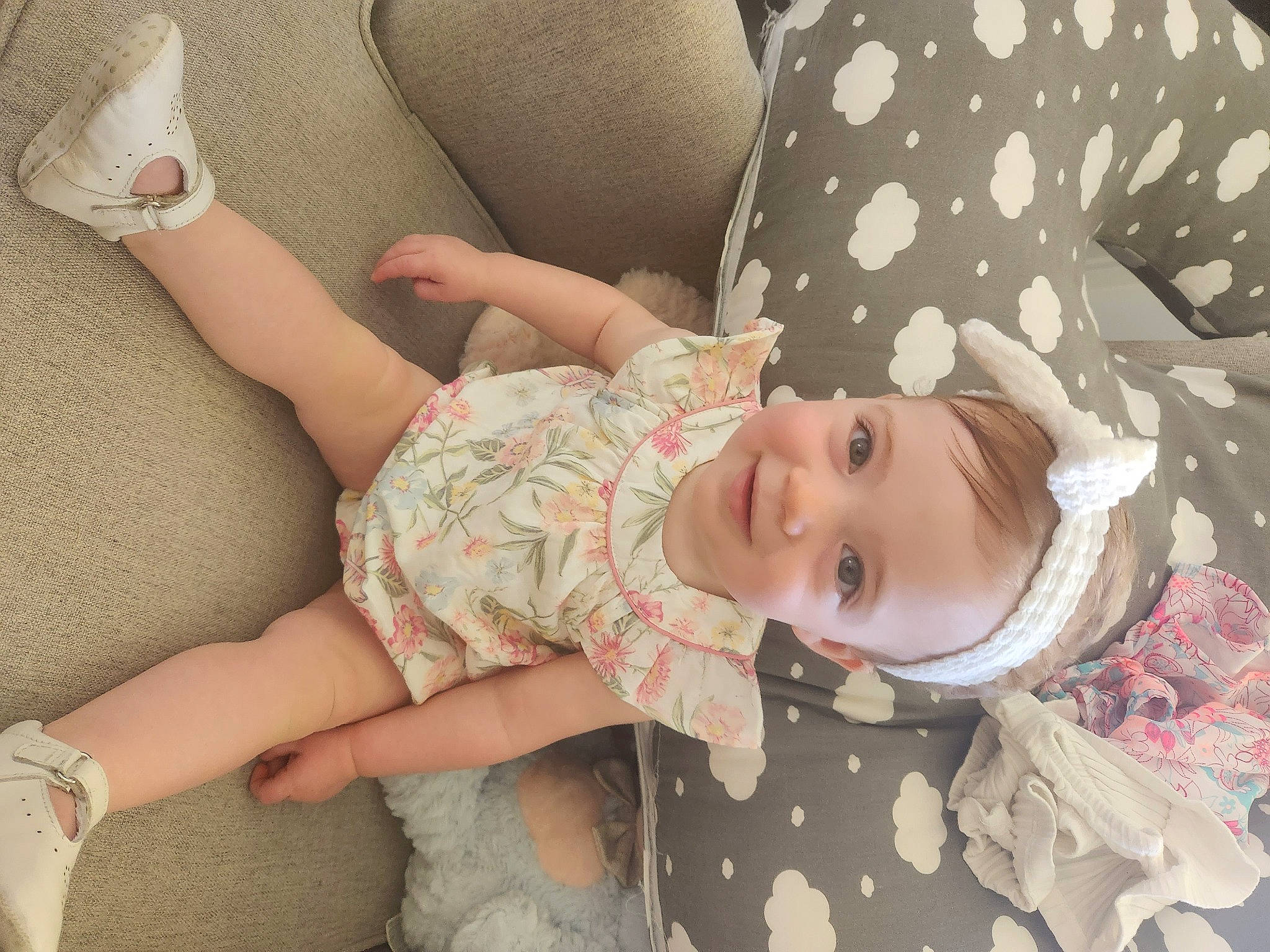 Chloe is registered to the contest to win money with this photo: baby, baby_products, baby_toddler_clothing, cheek, child, comfort, eye, happy, human_leg, joy, knee, pattern, person, sitting, skin, sleeve, smile, sock, thigh, toddler