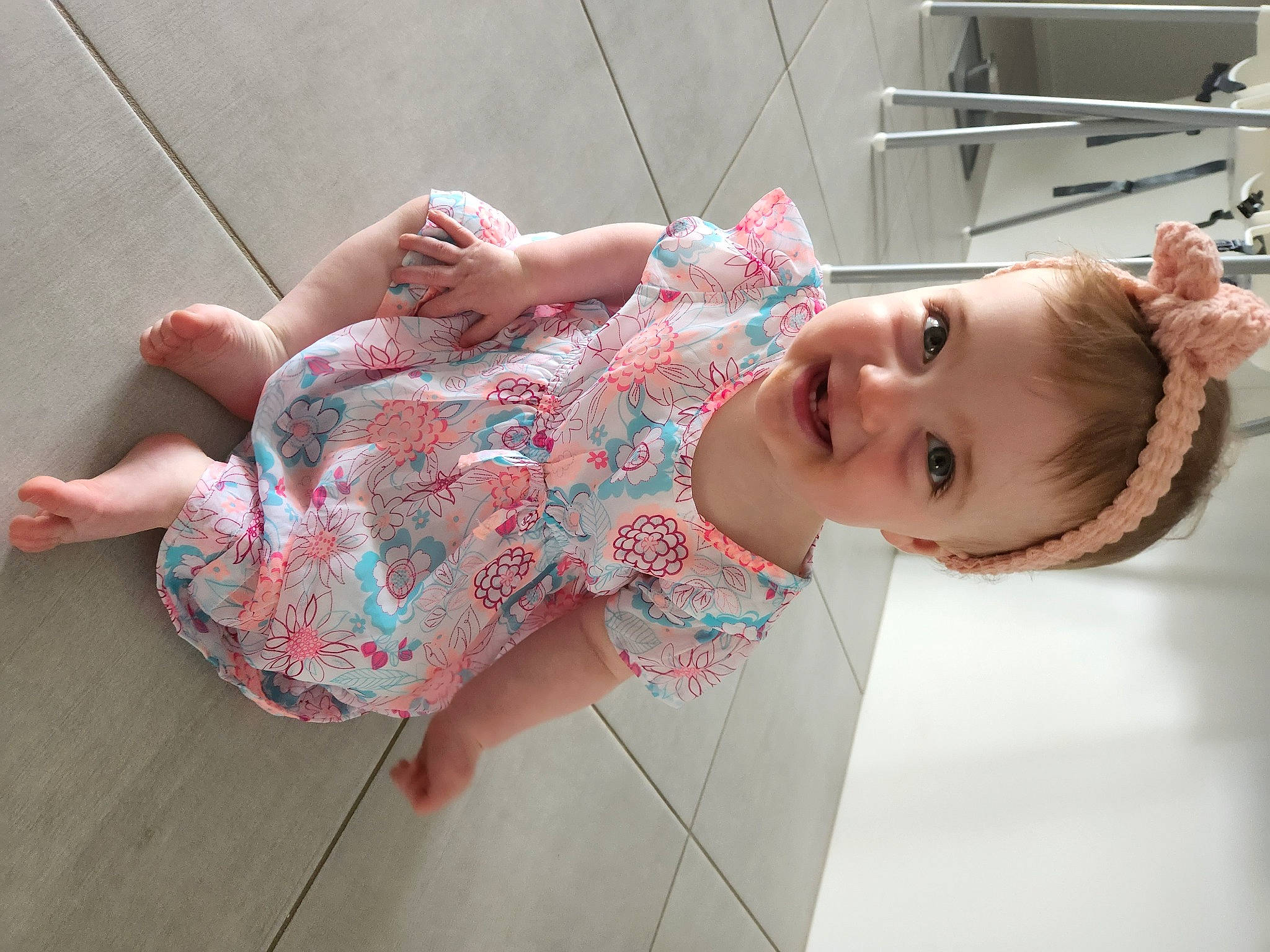 Chloe joined the competition — help win amazing prizes! baby_toddler_clothing, child, elbow, flooring, foot, fun, happy, human_leg, joint, joy, leisure, neck, pattern, person, pink, shoulder, sitting, skin, smile, thigh