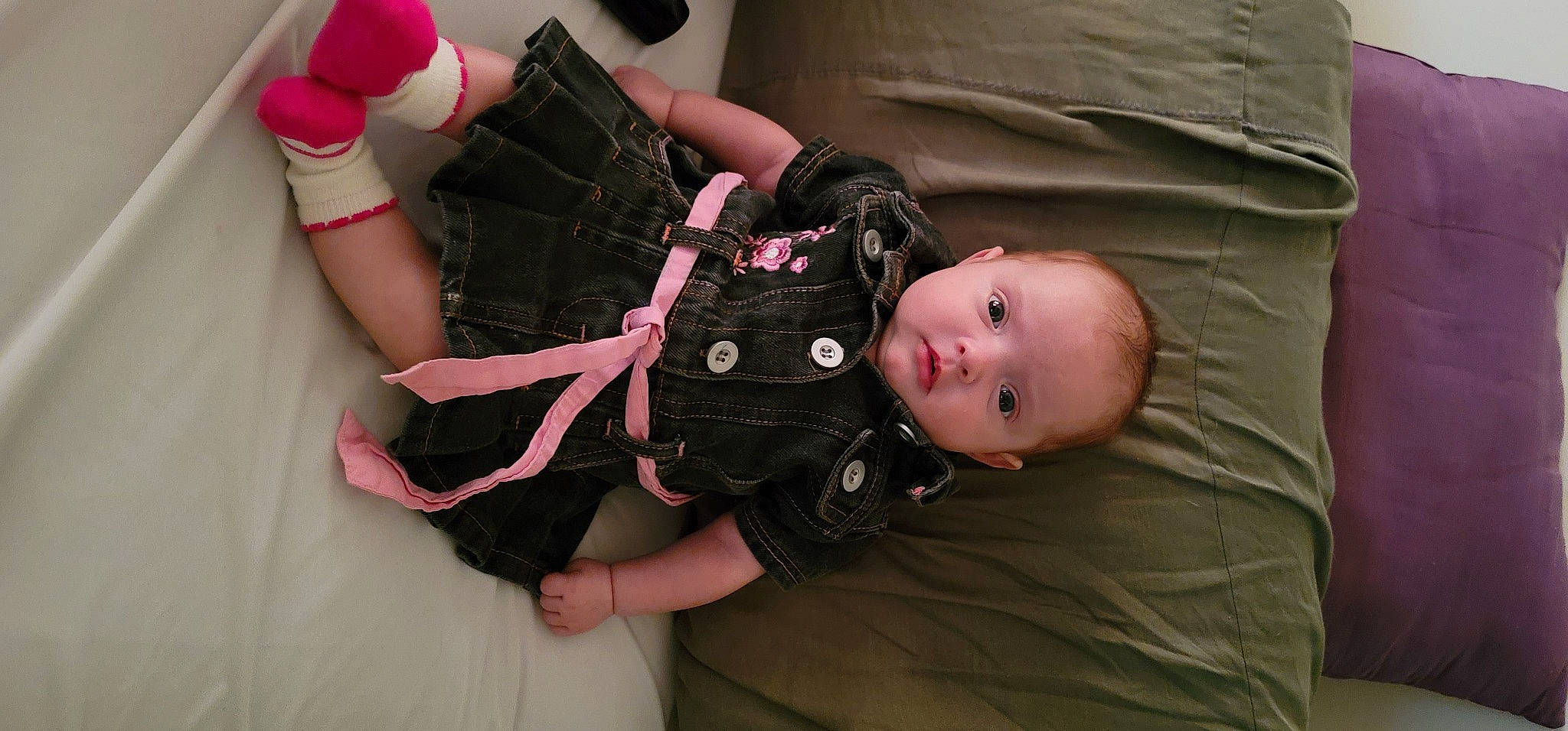 Kenzi joined the competition — help win amazing prizes! baby, baby_toddler_clothing, child, comfort, gesture, knee, leg, nail, pattern, person, personal_protective_equipment, pink, sitting, skin, sleeve, textile, thigh, toddler, waist, wood