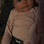 Joanna is registered to the contest to win money with this photo: baby, child, infant, pink_sweater, floral_pants, cute, face, eyes, portrait, cozy, indoor, person, young_child, clothing, expression, looking_up, sitting, warm, soft_light, curious