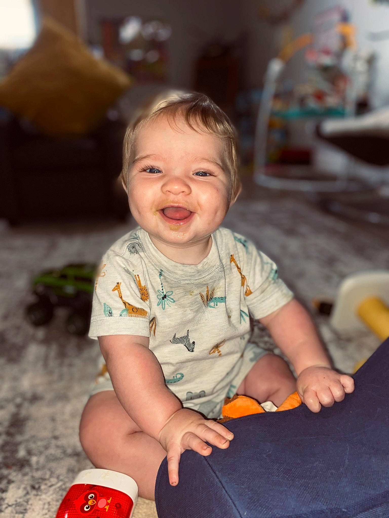 Jaidyn is registered to the contest to win money with this photo: baby, baby_playing_with_toys, baby_toddler_clothing, carmine, cheek, child, dress, flooring, fun, happy, leisure, orange, person, play, red, sitting, skin, smile, standing, t_shirt