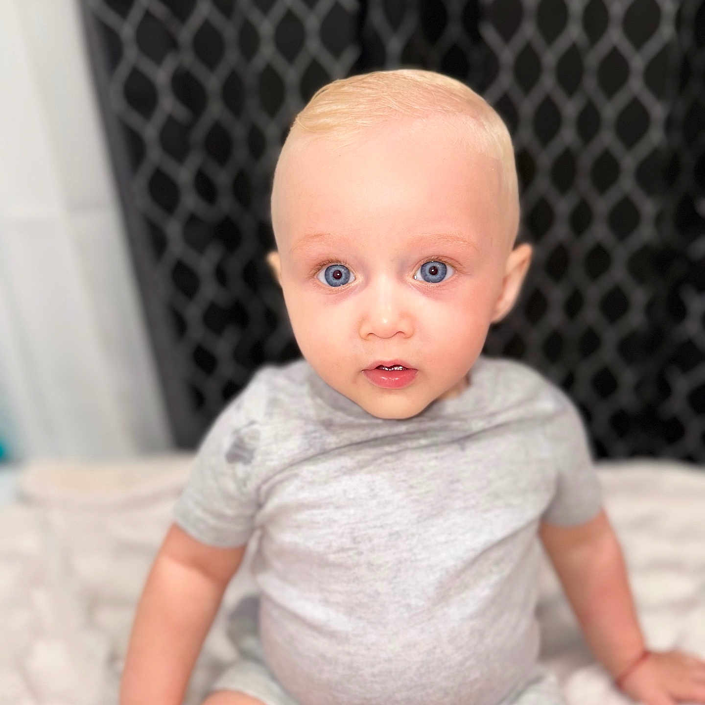Thiago joined the competition — help win amazing prizes! baby, bed, bedroom, blonde, bodypart, clothing, crawling, diaper, face, furniture, hair, head, indoors, person, photography, portrait, room, sitting, sleeve, t_shirt