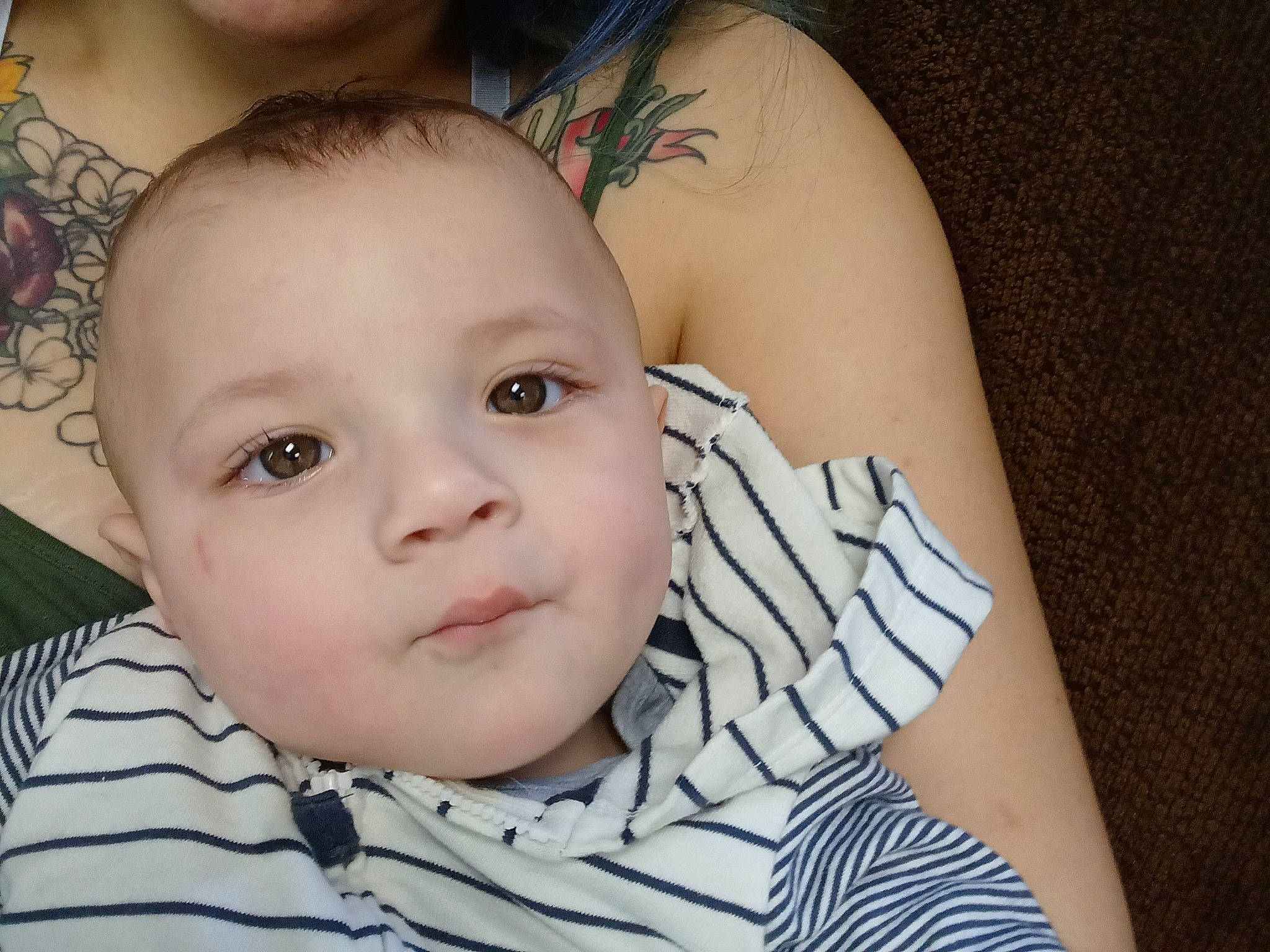 Danny is registered to the contest to win money with this photo: baby, baby_toddler_clothing, cheek, chin, eye, eyebrow, eyelash, facial_expression, finger, flash_photography, grass, happy, head, human_body, iris, leaf, lip, mouth, nose, person