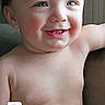 baby, child, smiling, blue_eyes, shirtless, portrait, happy, face, infant, skin, human, arm, hair, sitting, closeup, indoors, cute, expression, person, background