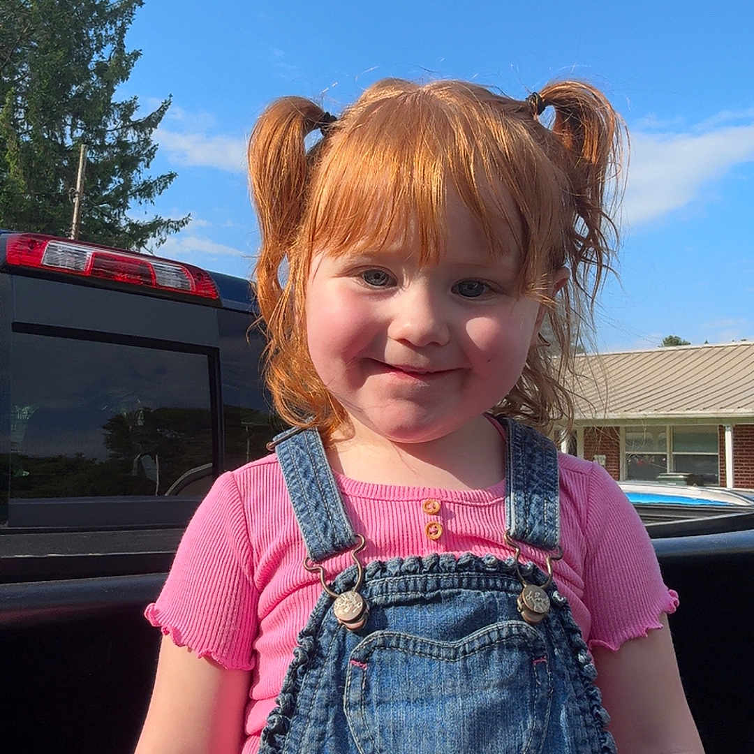 Blair is registered to the contest to win money with this photo: accessories, bodypart, child, clothing, face, female, finger, fir, girl, hand, head, jeans, pants, person, photography, plant, portrait, transportation, tree, vest