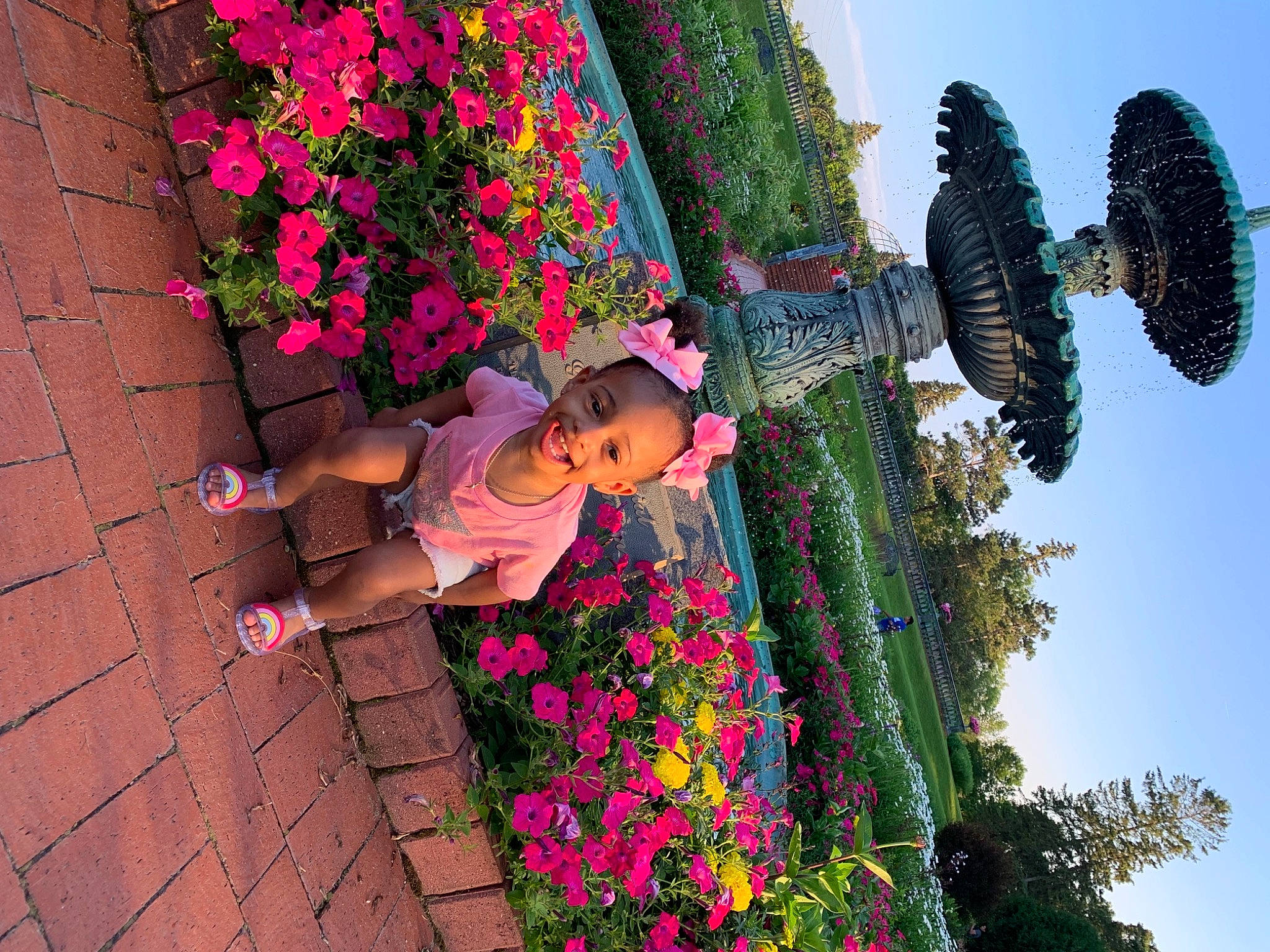 Kylie Lynn joined the competition — help win amazing prizes! beauty, botany, flower, fun, green, hat, joy, leaf, leisure, magenta, people_in_nature, person, petal, pink, plant, sky, summer, sunglasses, terrestrial_plant, toddler