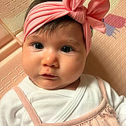 Rose participe au concours pour gagner de l'argent avec cette photo : baby, infant, headband, pink, bow, face, eyes, clothing, white_shirt, cute, portrait, child, soft_lighting, indoors, closeup, skin, expression, person, young_child, texture