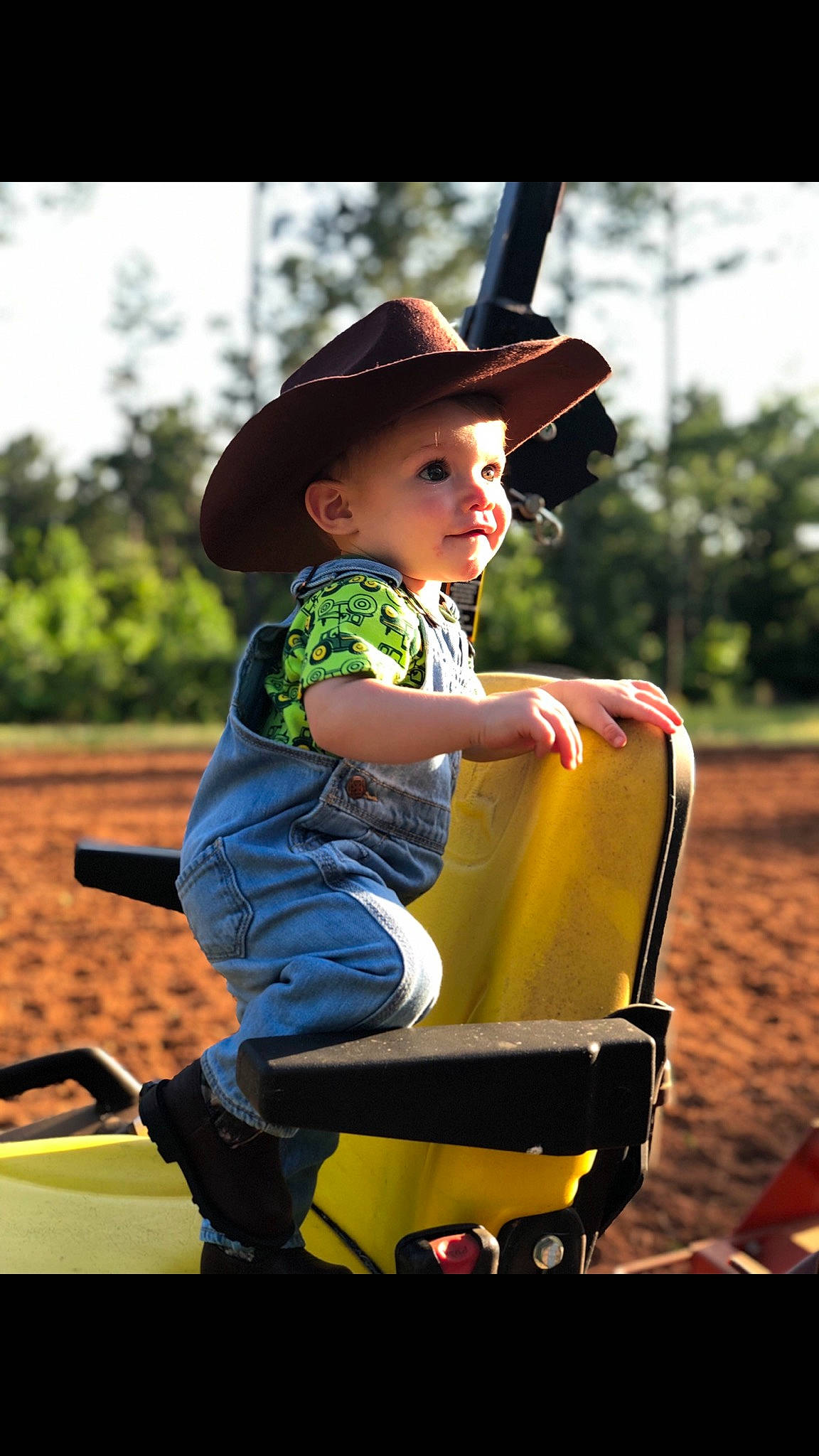 Camdyn is registered to the contest to win money with this photo: child, fun, person, play, playground, sitting, toddler, vehicle, yellow