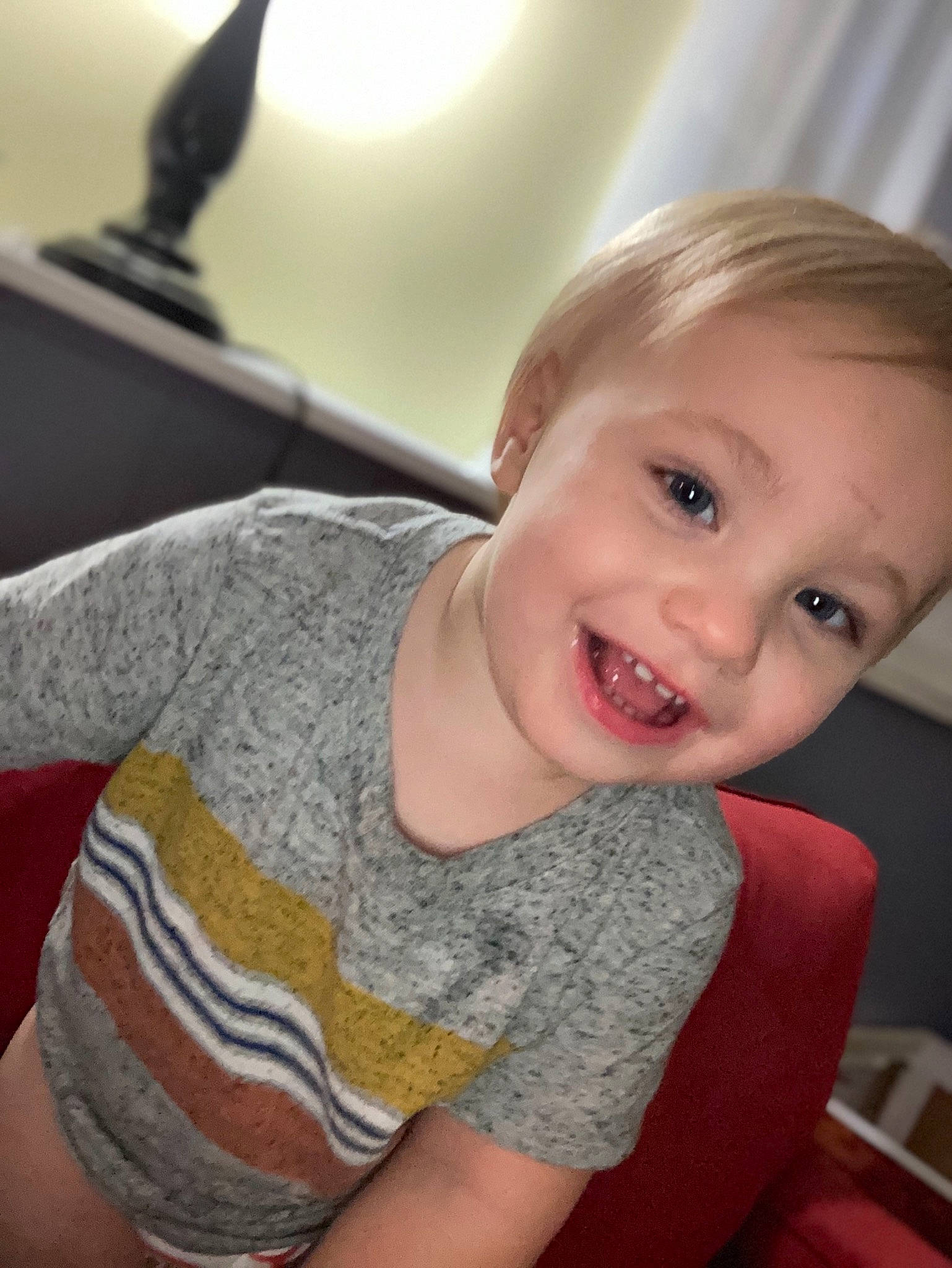 Zayden is registered to the contest to win money with this photo: arm, baby, blond, cheek, child, chin, ear, eye, face, facial_expression, happy, head, joy, lip, mouth, nose, organ, person, skin, smile