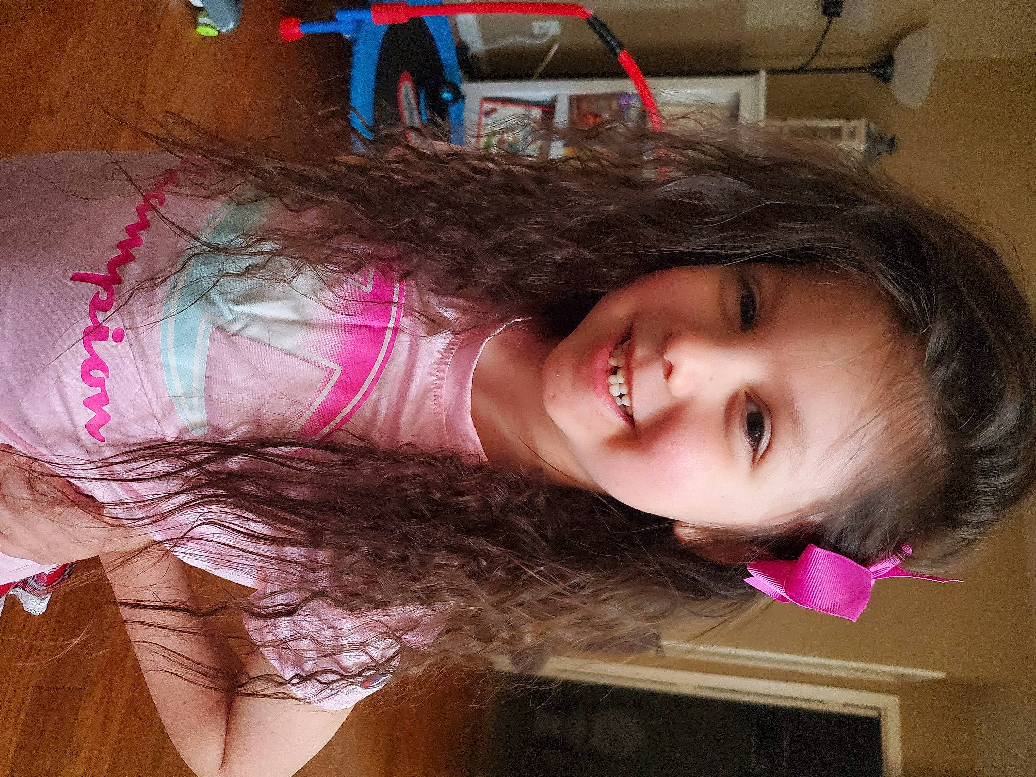 Avianna is registered to the contest to win money with this photo: black_hair, brown_hair, cheek, child, chin, eyebrow, eyelash, fun, happy, human_leg, joy, lip, long_hair, magenta, mouth, nose, person, pink, skin, smile