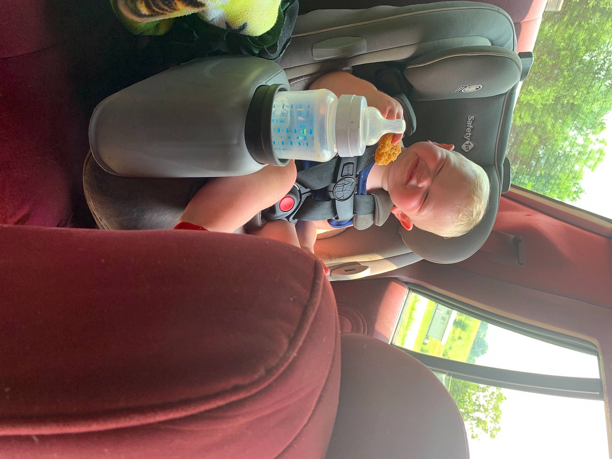 Colton is registered to the contest to win money with this photo: auto_part, automotive_design, automotive_exterior, automotive_lighting, automotive_window_part, bottle, car, car_seat, family_car, finger, gas, glass, helmet, joy, motor_vehicle, person, steering_wheel, tree, vehicle, vehicle_door