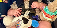 Markus joined the competition — help win amazing prizes! baby, car_seat, child, closeup, clothing, colorful, curious_expression, cute, face, hand, indoor, infant, legs, portrait, safety, seat, soft_toys, straps, toy, young