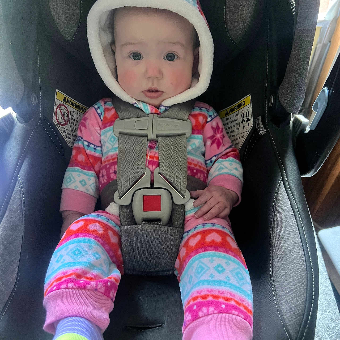 Raylan is registered to the contest to win money with this photo: baby, bonnet, cap, clothing, coat, face, hat, head, hood, hoodie, hosiery, jacket, knitwear, person, photography, portrait, sock, sweater, sweatshirt, transportation
