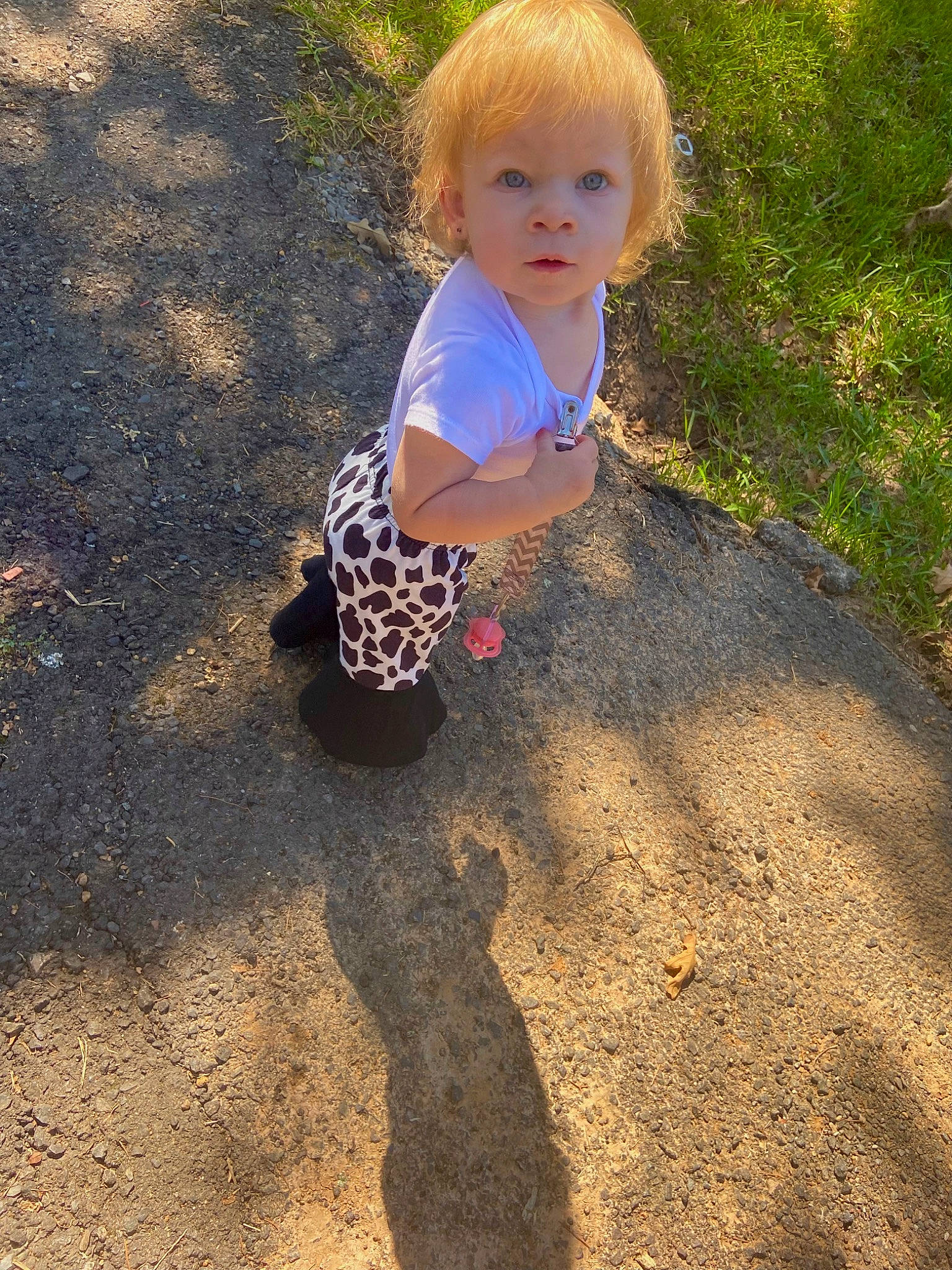 Maddie joined the competition — help win amazing prizes! asphalt, baby, baby_toddler_clothing, child, fun, grass, hairstyle, head, landscape, pattern, people_in_nature, person, recreation, road_surface, sand, shadow, sitting, soil, tints_and_shades, toddler
