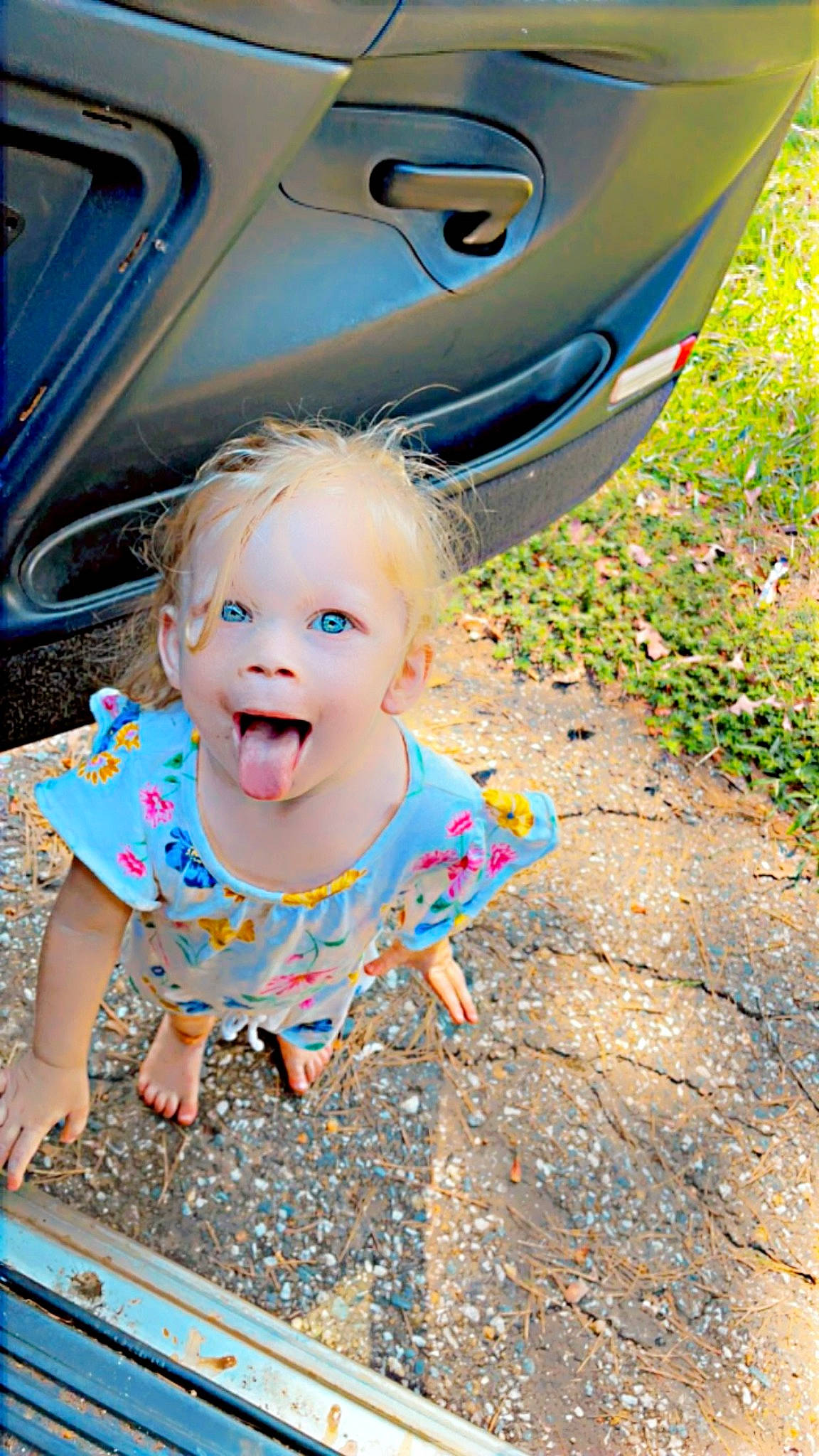 Maddie is registered to the contest to win money with this photo: asphalt, automotive_design, automotive_exterior, automotive_lighting, automotive_tire, baby, baby_toddler_clothing, blue, bumper, car, fender, fun, hood, motor_vehicle, person, tints_and_shades, tire, toy, trunk, vehicle