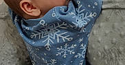 Weston is registered to the contest to win money with this photo: baby, bed, blanket, blue_clothing, child, closeup, cute, face, indoors, infant, onesie, peaceful, resting, side_profile, sleepwear, small_person, snowflake_pattern, soft_light, texture, warm