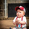Weston joined the competition — help win amazing prizes! toddler, child, baseball, cap, suspenders, peanuts, bat, sports, outdoor, dirt, ball, striped_shorts, white_tshirt, summer, cute, baby, playing, sunlight, field, portrait