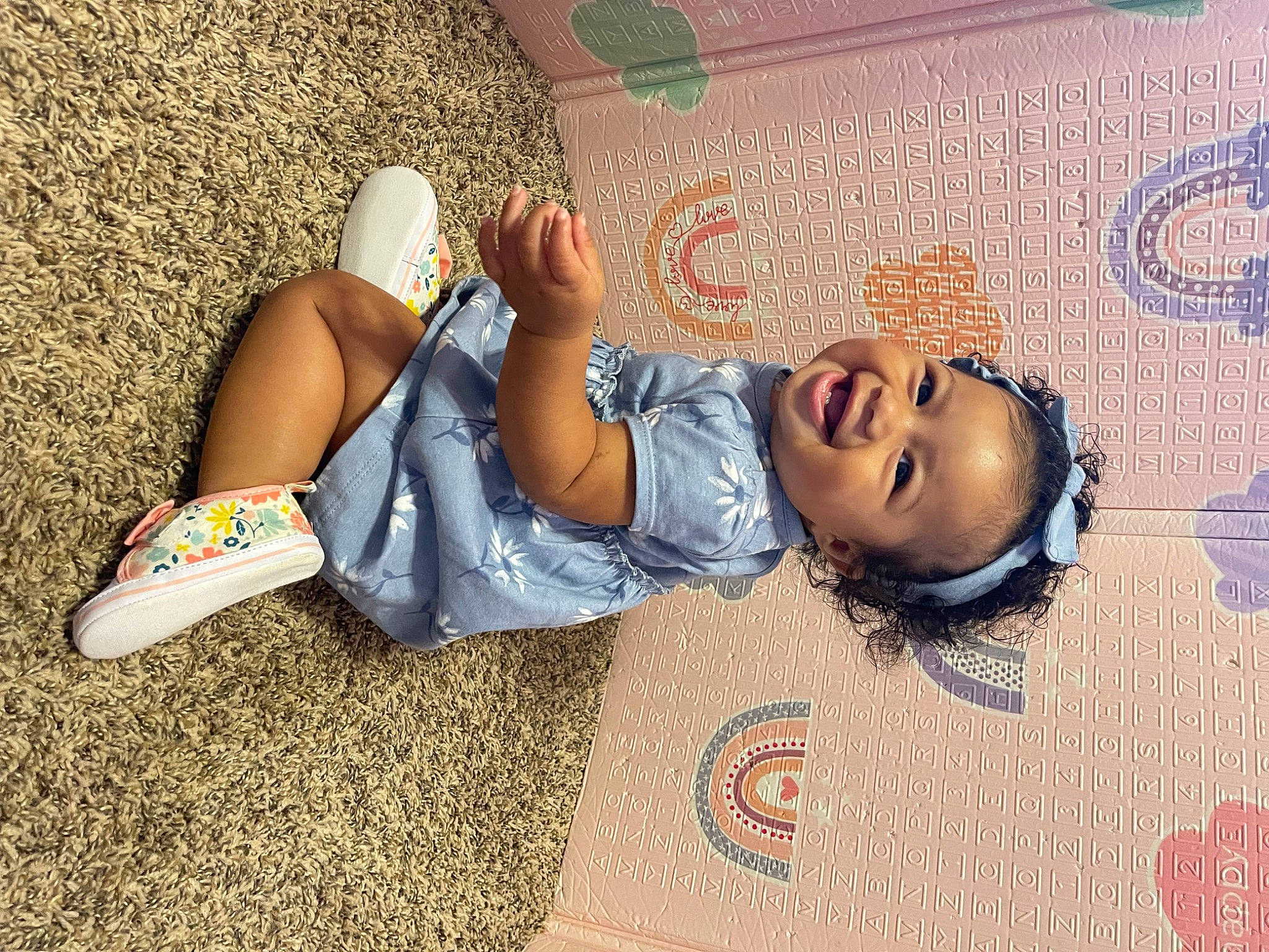 Aaliyah is registered to the contest to win money with this photo: art, child, comfort, cool, denim, fashion, floor, flooring, fun, grass, hairstyle, human_leg, knee, leisure, person, road_surface, smile, textile, thigh, wall