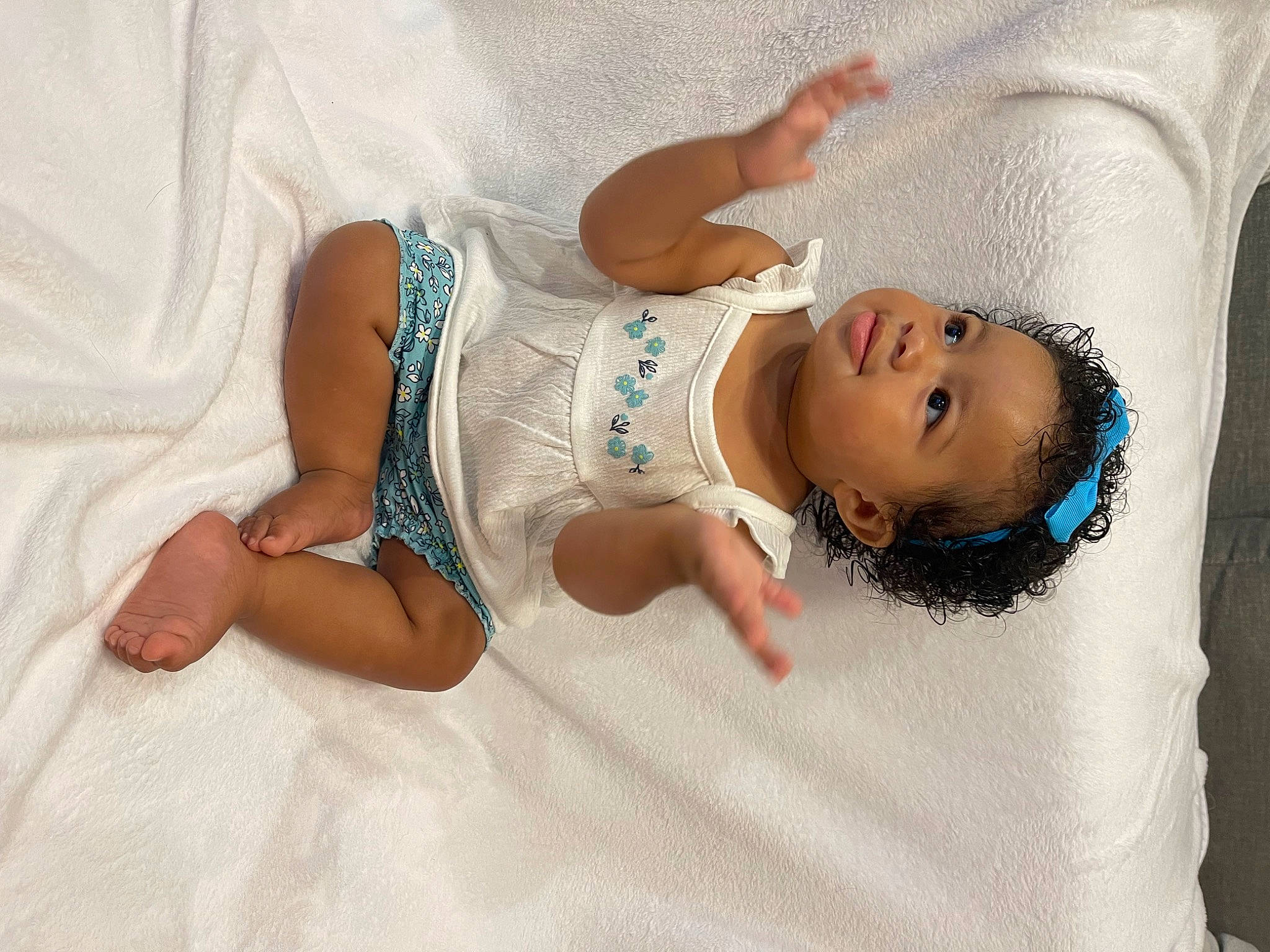 Aaliyah is registered to the contest to win money with this photo: abdomen, baby, baby_products, baby_sleeping, baby_toddler_clothing, cheek, comfort, eye, face, foot, head, headgear, human_body, human_leg, leg, linens, person, skin, sleeve, smile