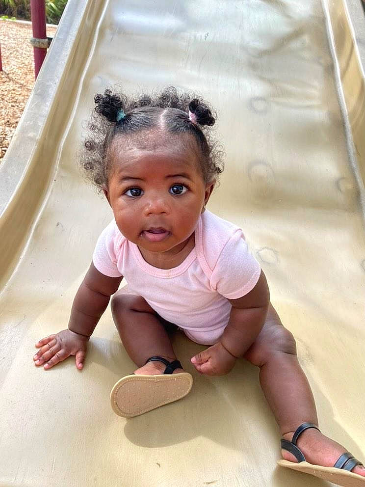 Wynter is registered to the contest to win money with this photo: baby, baby_toddler_clothing, barefoot, cheek, child, crawling, flooring, foot, fun, grass, happy, leisure, people, person, recreation, sitting, skin, soil, toddler, water