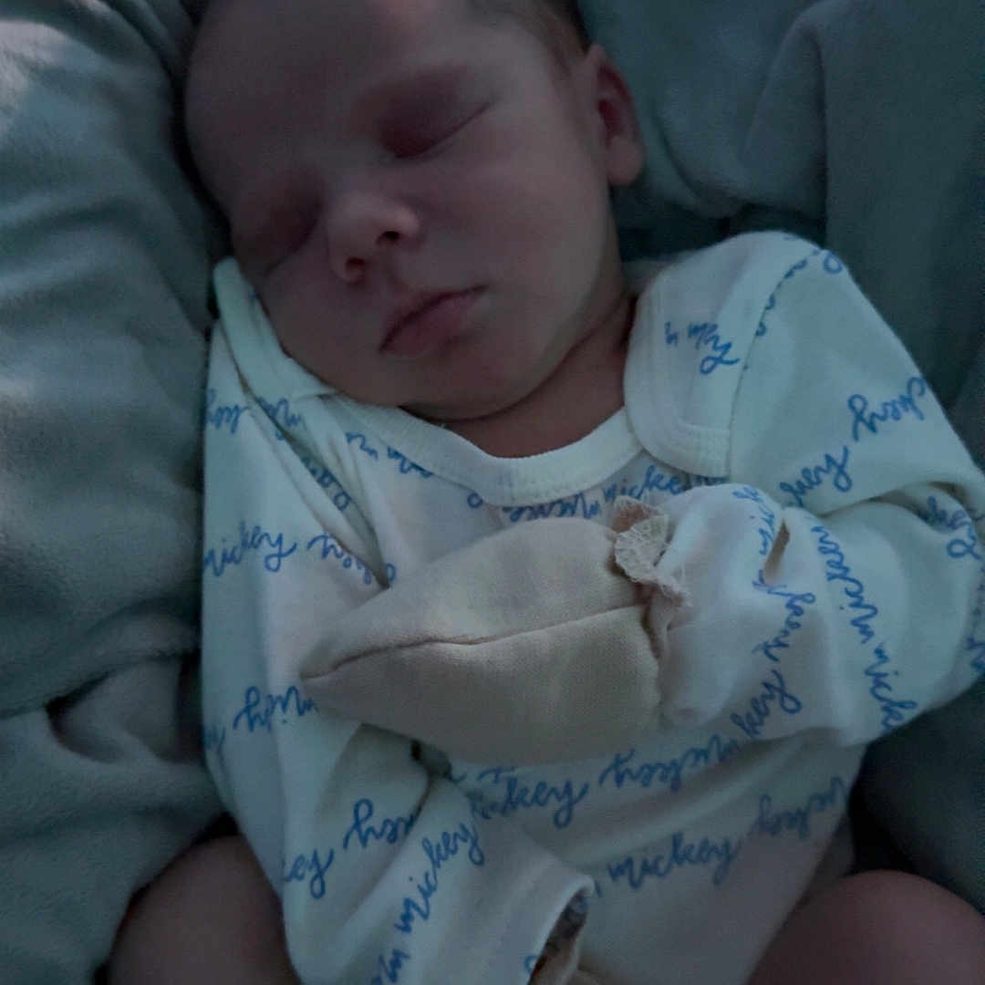 Stylez is registered to the contest to win money with this photo: architecture, baby, bed, blanket, clothing, cradle, crib, cushion, face, furniture, glove, head, homedecor, infantbed, newborn, person, photography, portrait, quilt, sleeping