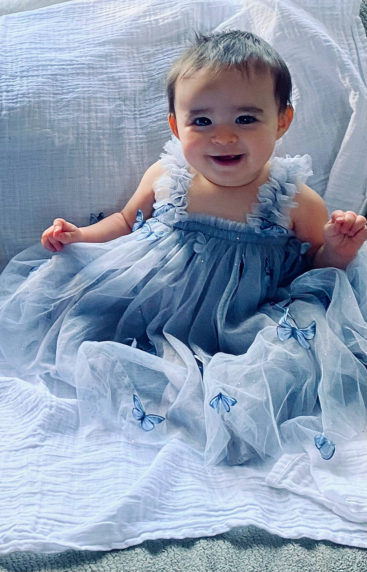 Lydia is registered to the contest to win money with this photo: arm, azure, baby_toddler_clothing, beauty, child, day_dress, dress, electric_blue, embellishment, eye, face, flash_photography, hair, happy, human_body, iris, joy, person, skin, sleeve