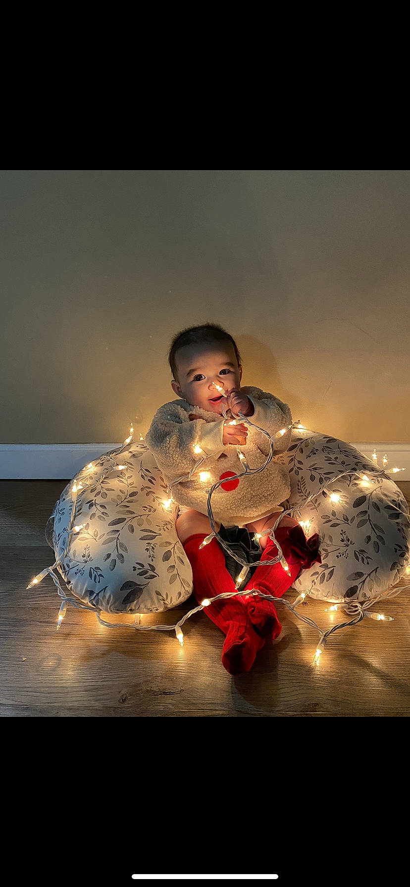 Lydia is registered to the contest to win money with this photo: art, carmine, christmas, christmas_decoration, christmas_ornament, darkness, entertainment, event, flash_photography, happy, holiday, ornament, performing_arts, person, room, sitting, still_life, still_life_photography, toy, tradition