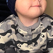 Noah Bautista joined the competition — help win amazing prizes! baby, child, face, hat, knit_hat, onesie, ghost_pattern, infant, cute, cozy, portrait, close_up, sleepwear, warm_clothing, young_child, indoor, expression, looking_away, soft_light, skin