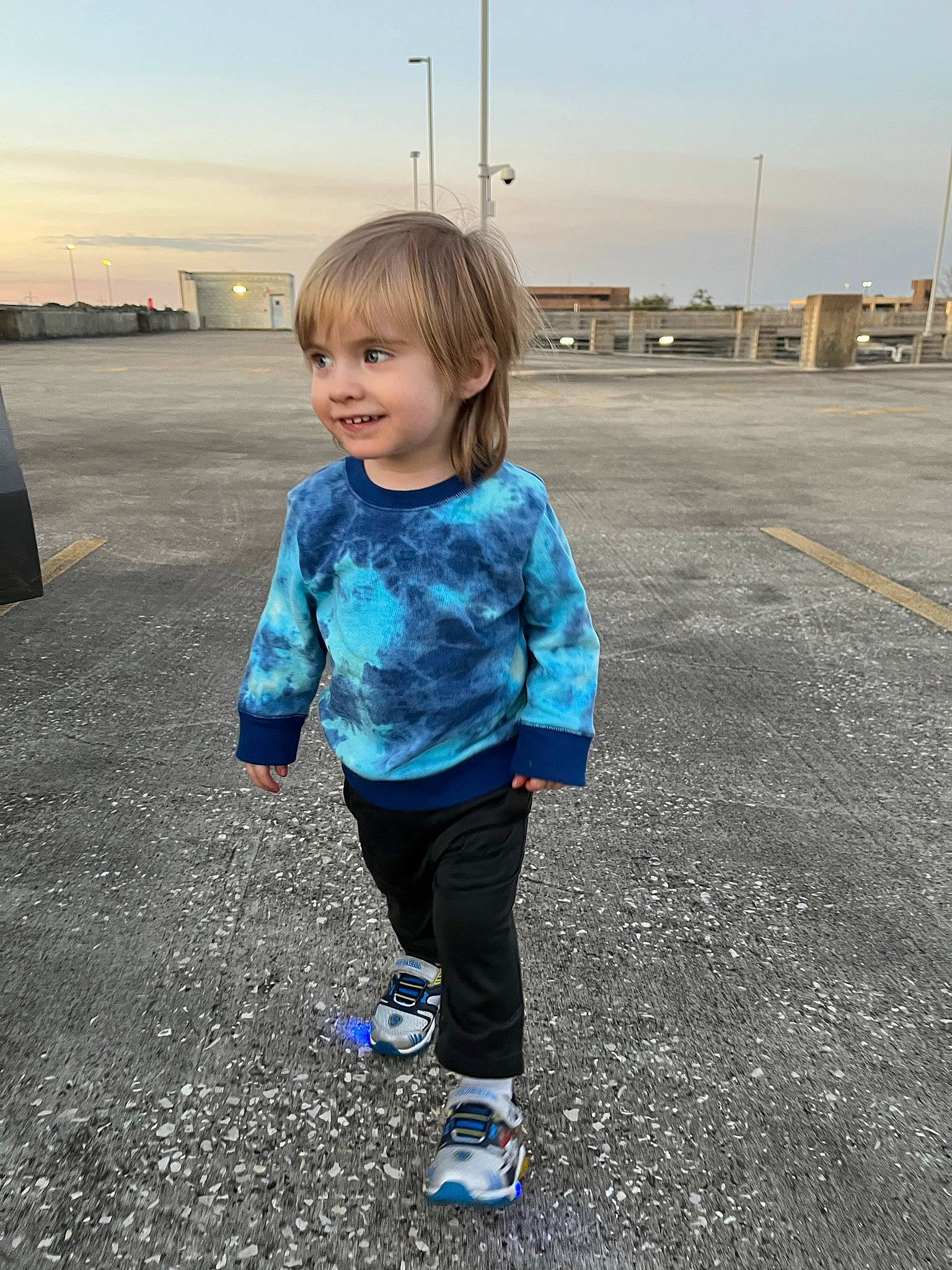 Blake is registered to the contest to win money with this photo: asphalt, body_of_water, child, city, denim, electric_blue, eye, fun, grass, happy, horizon, joy, leisure, person, recreation, road_surface, sky, smile, standing, summer