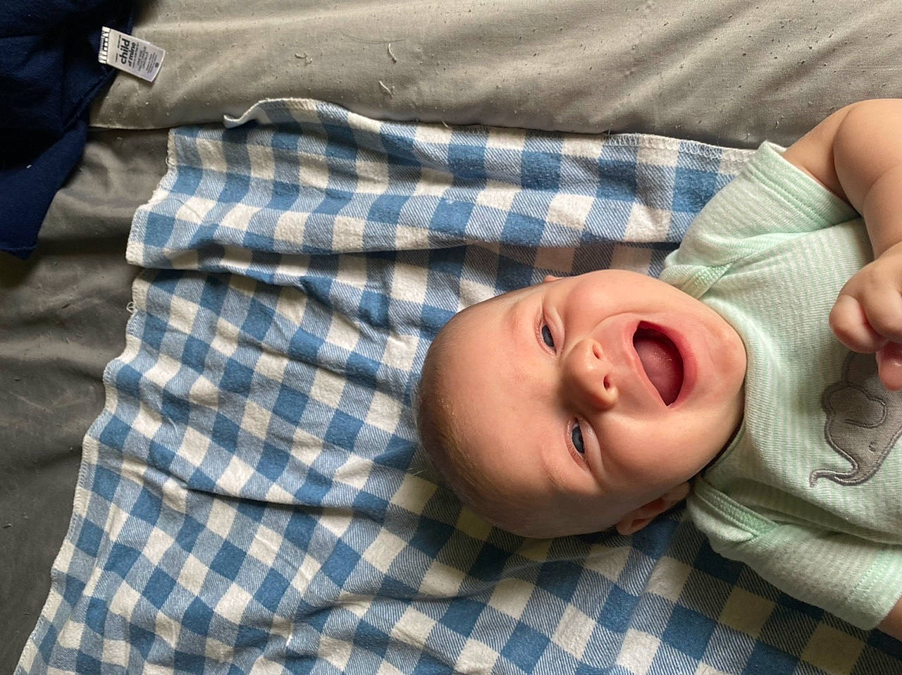 Braxton joined the competition — help win amazing prizes! baby, baby_products, baby_sleeping, baby_toddler_clothing, bedtime, cheek, child, comfort, eye, happy, head, linens, pattern, person, plaid, room, sleep, sleeve, smile, tartan