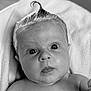 Violet is registered to the contest to win money with this photo: baby, infant, face, eyes, soap, hair, drool, skin, closeup, portrait, wet, expression, cute, curly_hair, child, bath_time, black_and_white, newborn, head, towel
