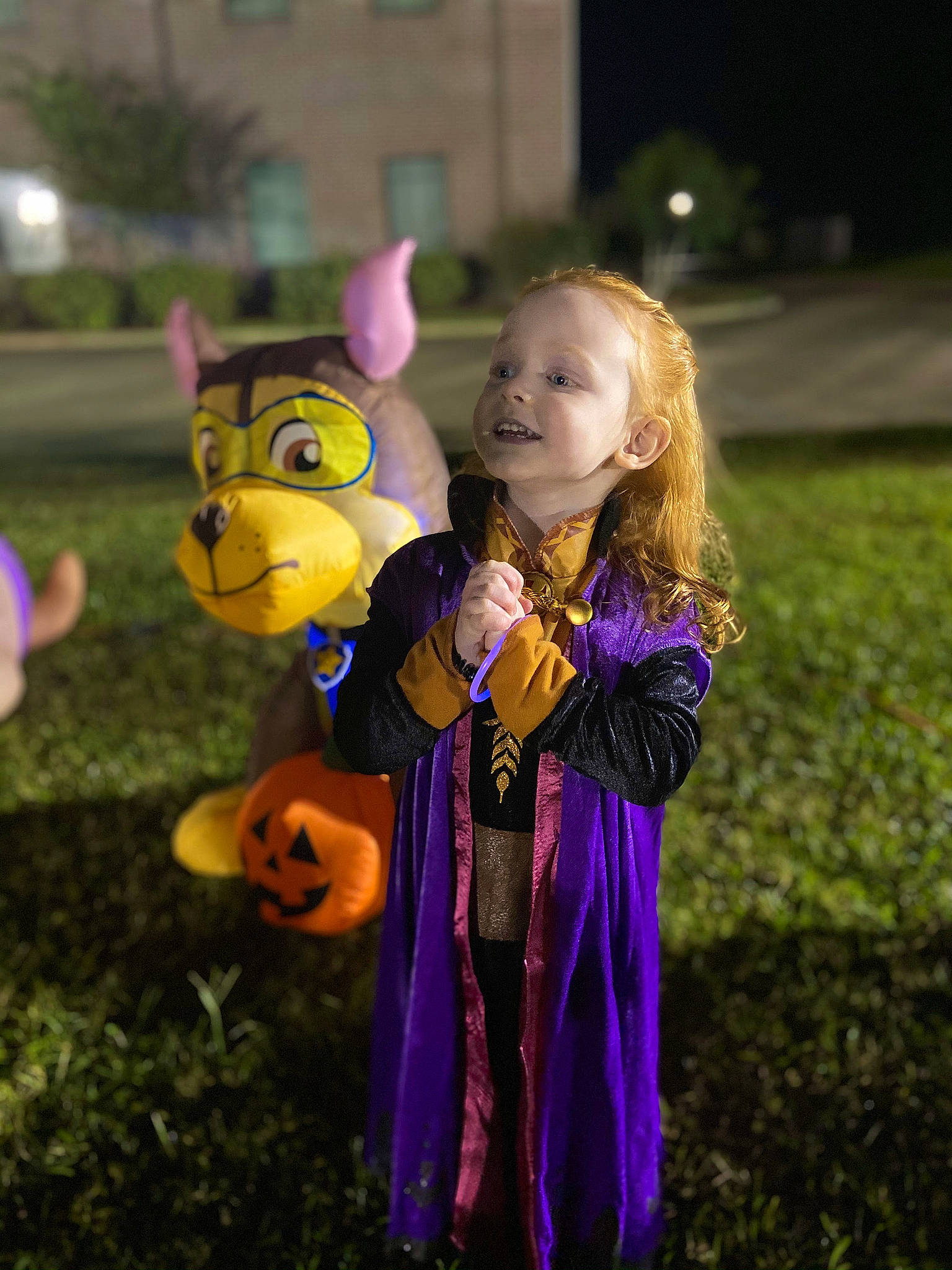 Alex is registered to the contest to win money with this photo: baby, child, fawn, fun, gesture, grass, happy, interaction, leisure, magenta, people_in_nature, person, pink, plant, play, pumpkin, purple, recreation, smile, toddler