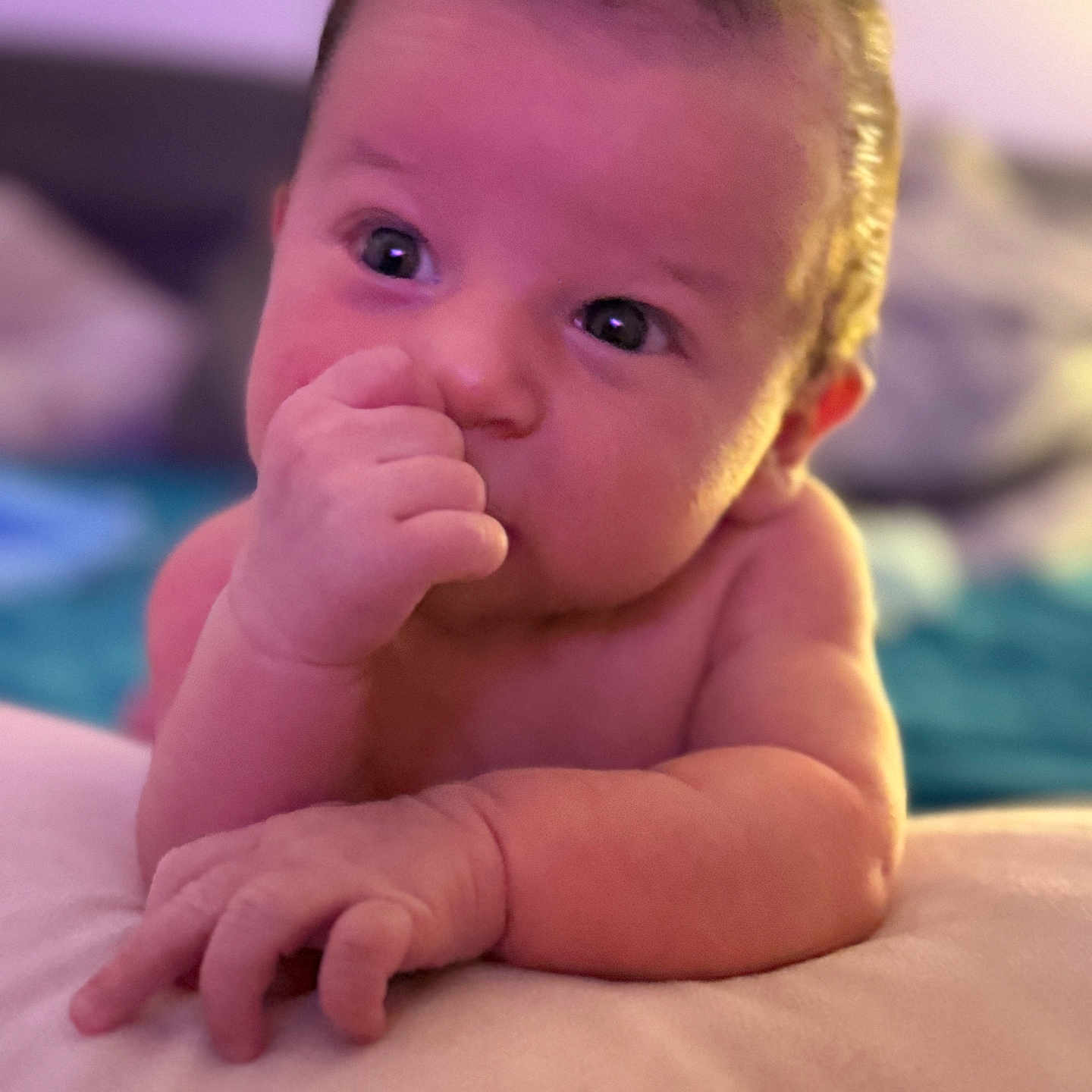 Theodor joined the competition — help win amazing prizes! baby, blurred_background, child, close_up, couch, curious, cute, expression, face, hand, indoor, infant, lying_down, newborn, person, portrait, skin, soft_lighting, thumb, young