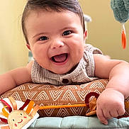 Isaac joined the competition — help win amazing prizes! baby, smiling, face, child, toy, play_mat, happy, infant, cute, indoors, soft_toy, carpet, chubby, toddler, clothing, closeup, expression, human, warm_colors, baby_girl