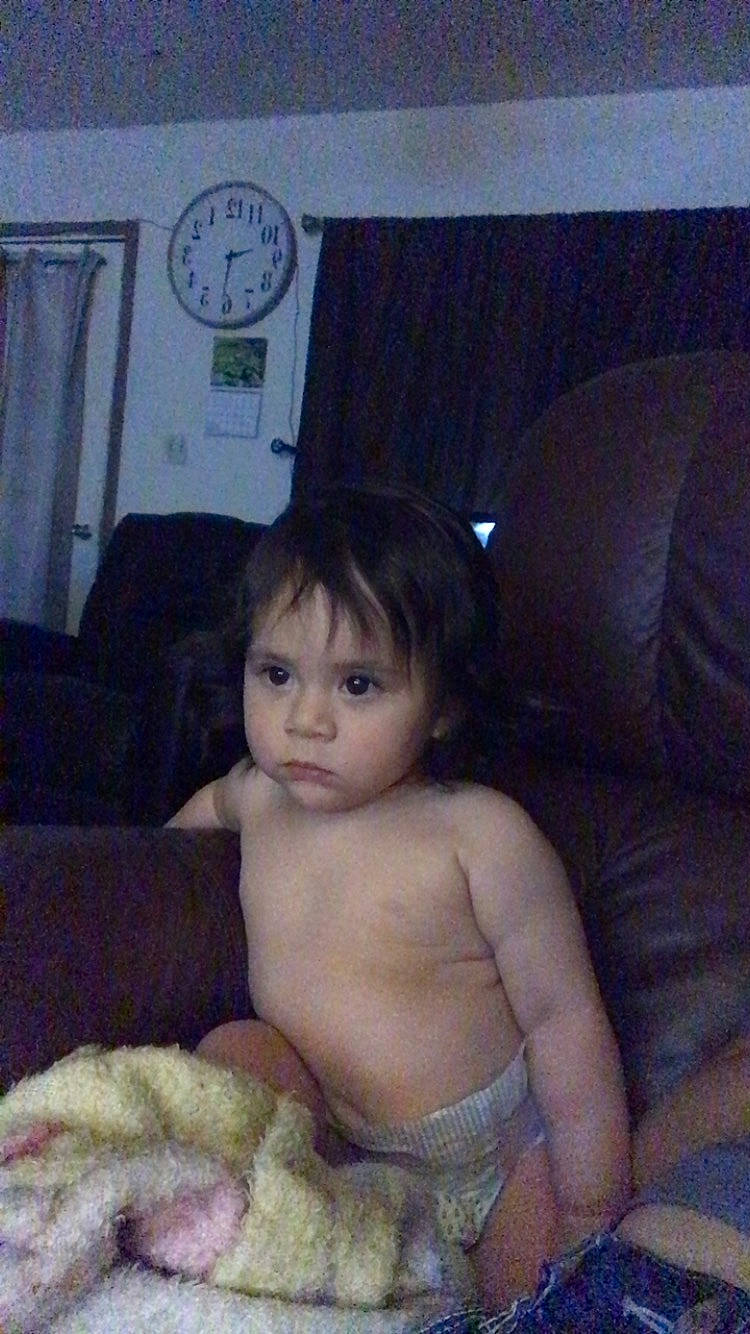 Jedidiah joined the competition — help win amazing prizes! abdomen, baby, black_hair, cheek, chest, child, clock, comfort, couch, eye, flesh, iris, lap, linens, person, quartz_clock, room, sitting, skin, thumb